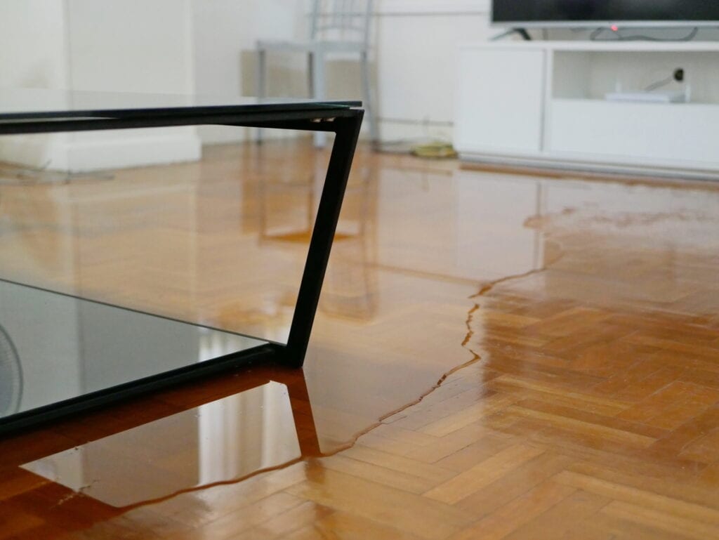 Standing water across a parquet floor in an Oahu home