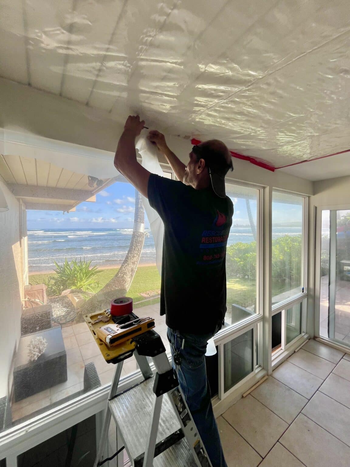 Sealing off a lanai ceiling before we open it up.