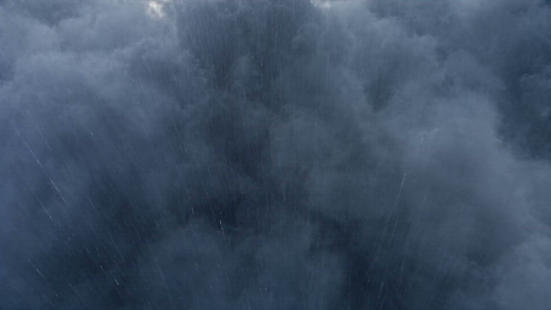 Heavy rain clouds over the Ko'olau mountains on Oahu at the start of a storm.